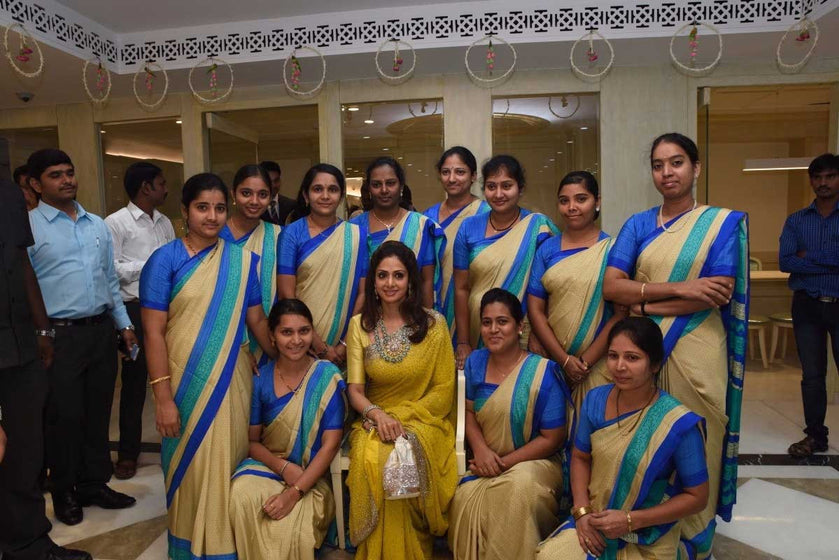 Bollywood Star Sridevi Boney Kapoor with the staff of a premium jewellery showroom donned Uniform Sarees by www.uniformsarees.in